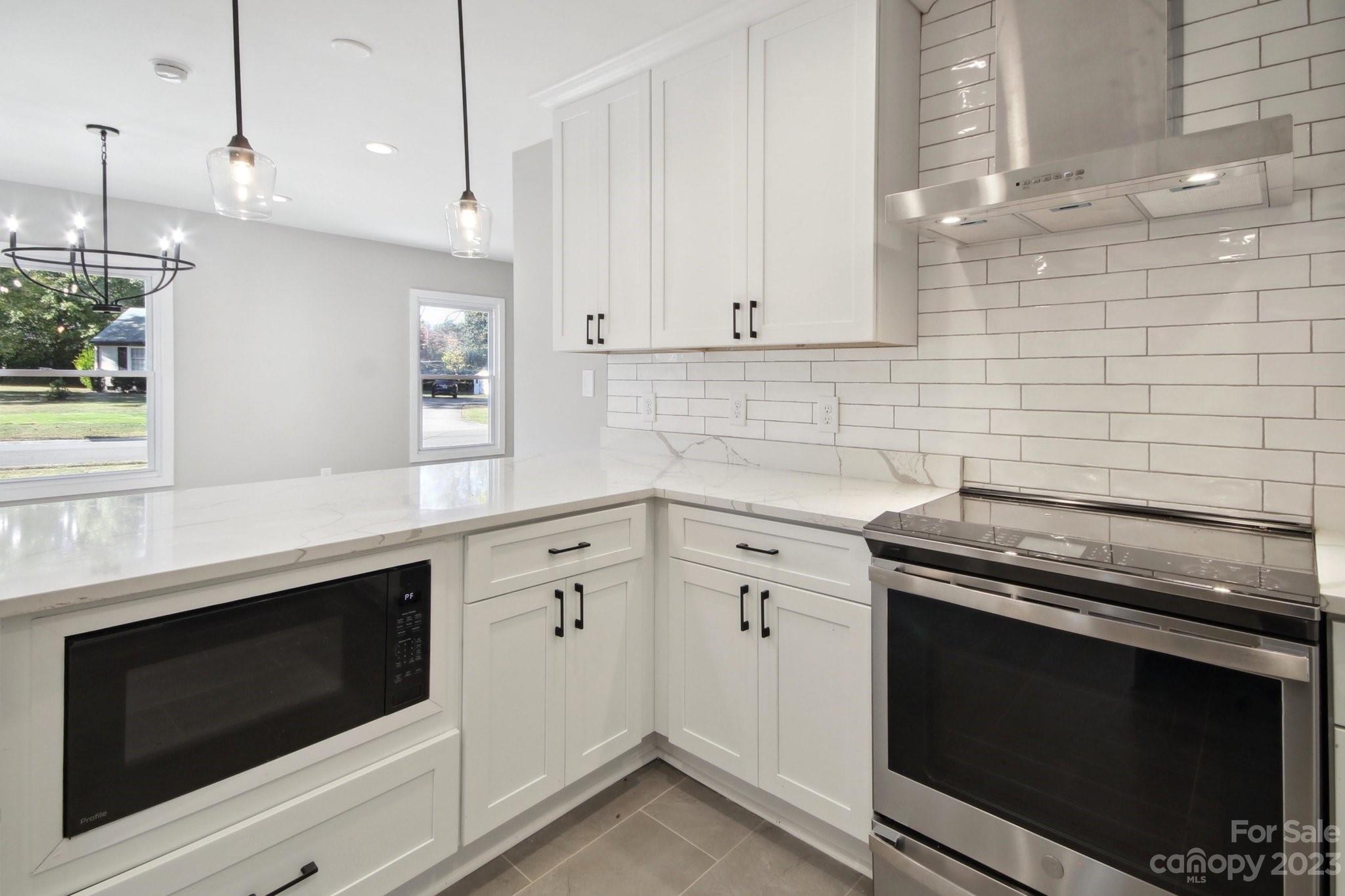 5225 Farmbrook Drive Charlotte, NC 28210 - Photo 6 of 18 a kitchen with granite countertop cabinets stainless steel appliances and a sink