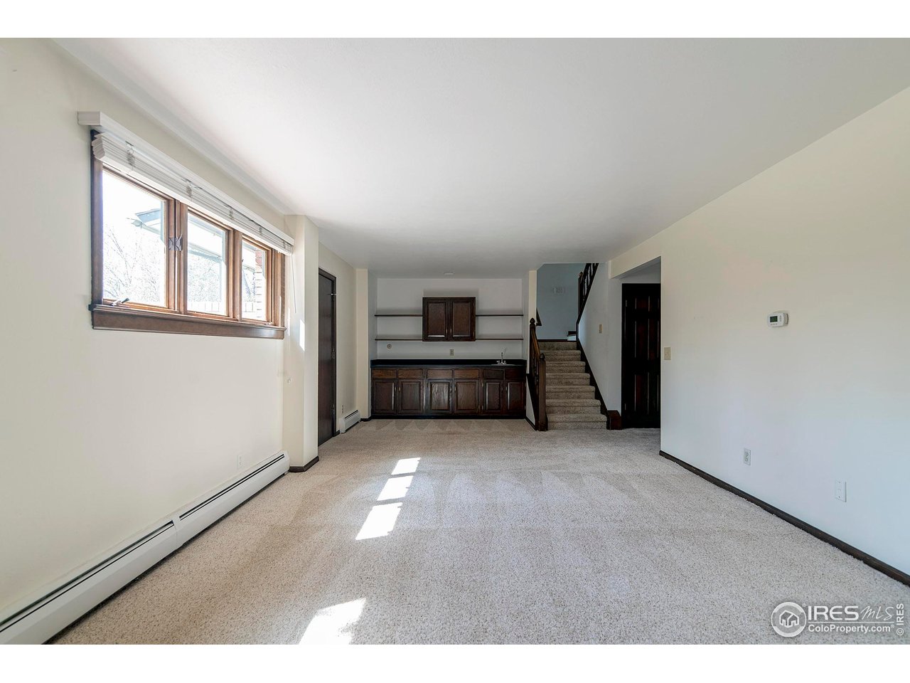 6844 Roaring Fork Trail Boulder, CO 80301 - Photo 20 of 37 a big room with closet and windows