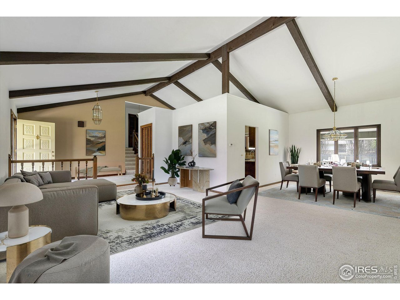 6844 Roaring Fork Trail Boulder, CO 80301 - Photo 2 of 37 a living room with furniture and a large window