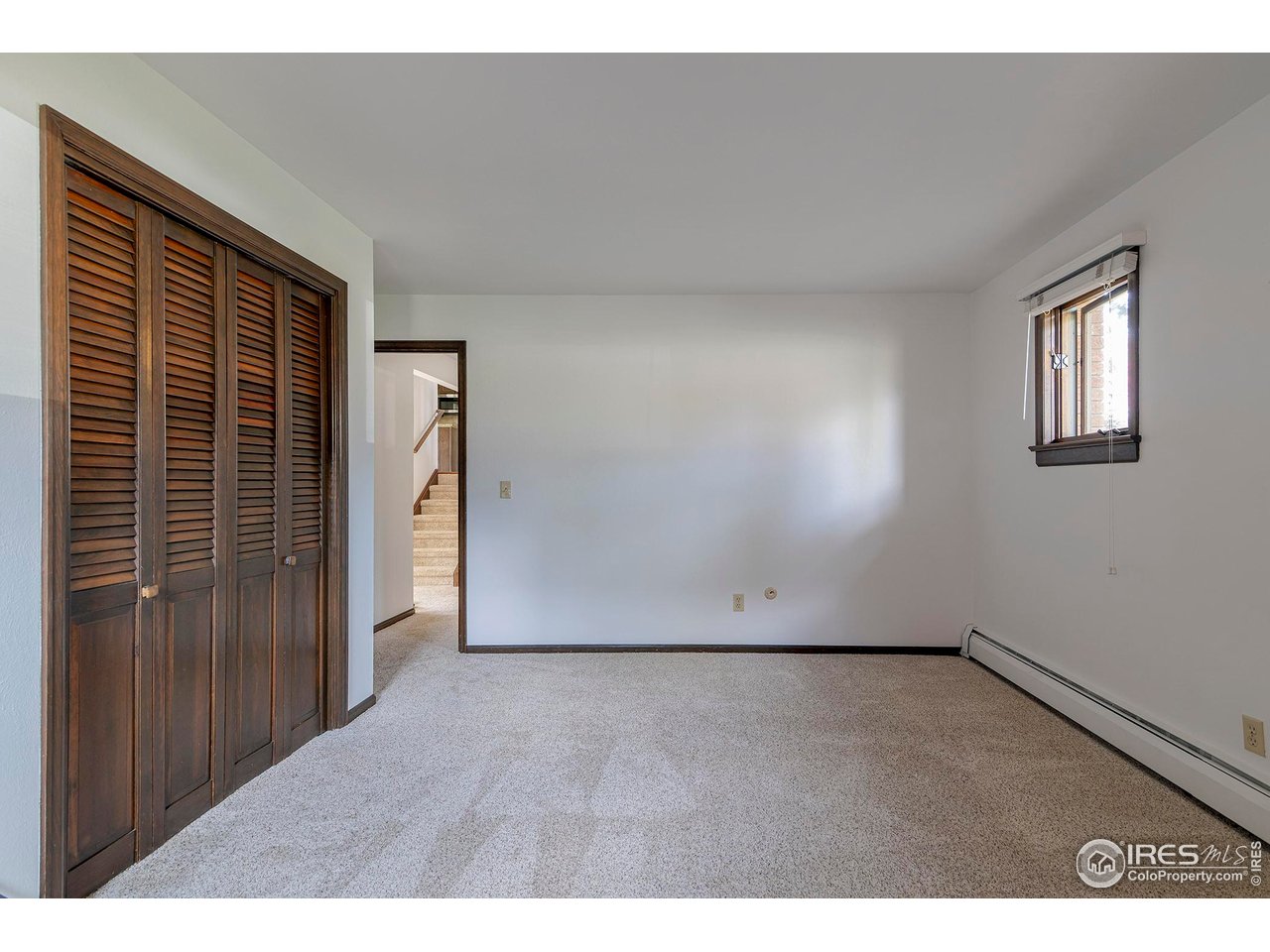6844 Roaring Fork Trail Boulder, CO 80301 - Photo 24 of 37 a view of an empty room with wooden floor