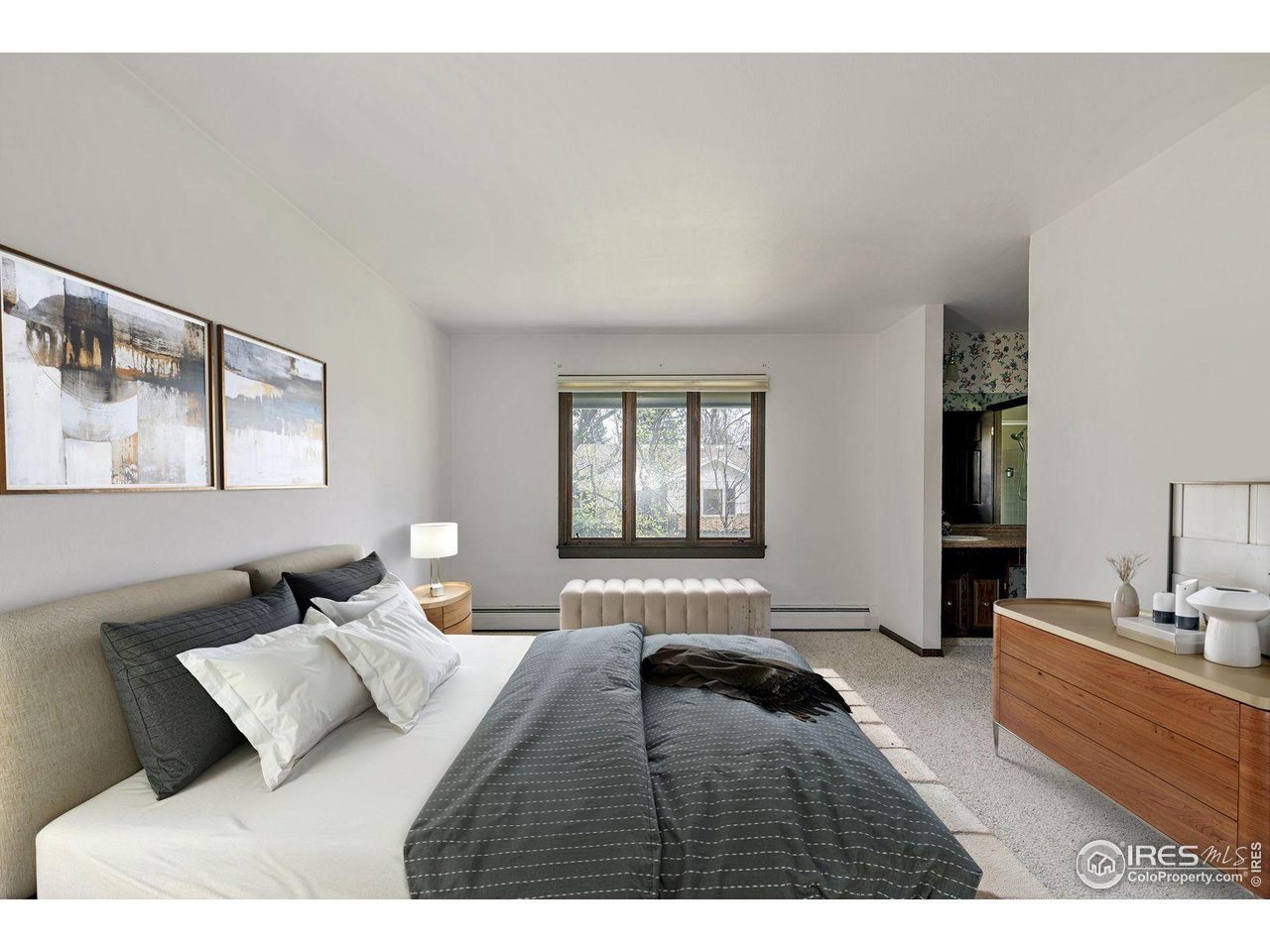 6844 Roaring Fork Trail Boulder, CO 80301 - Photo 5 of 37 a bedroom with a bed window and couch