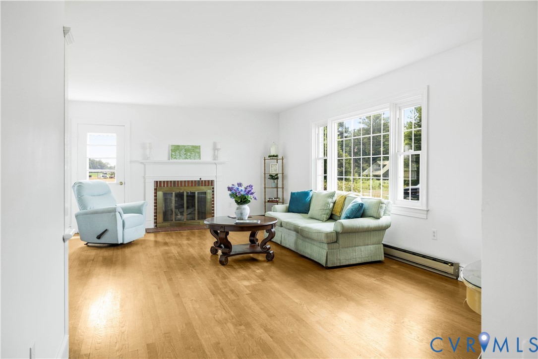 192 Morattico Road Lancaster, VA 22503 - Photo 15 of 34 a living room with furniture and a fireplace