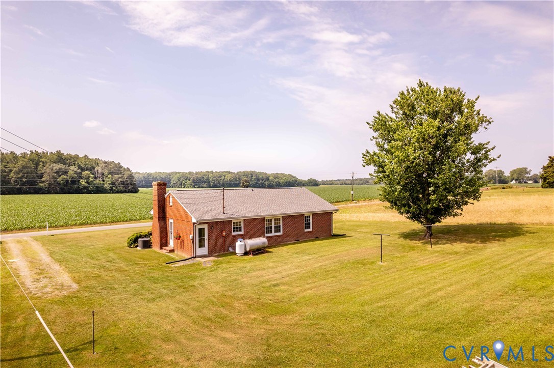 192 Morattico Road Lancaster, VA 22503 - Photo 23 of 34 a view of a house with pool and a yard