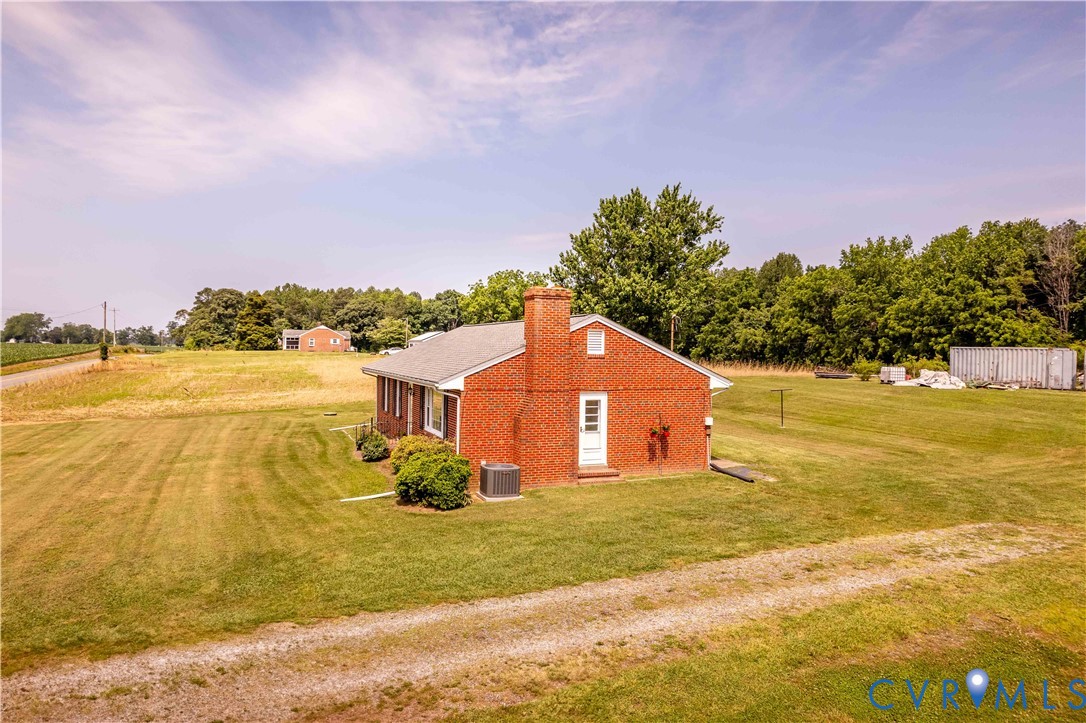 192 Morattico Road Lancaster, VA 22503 - Photo 26 of 34 a front view of a house with a yard and lake view