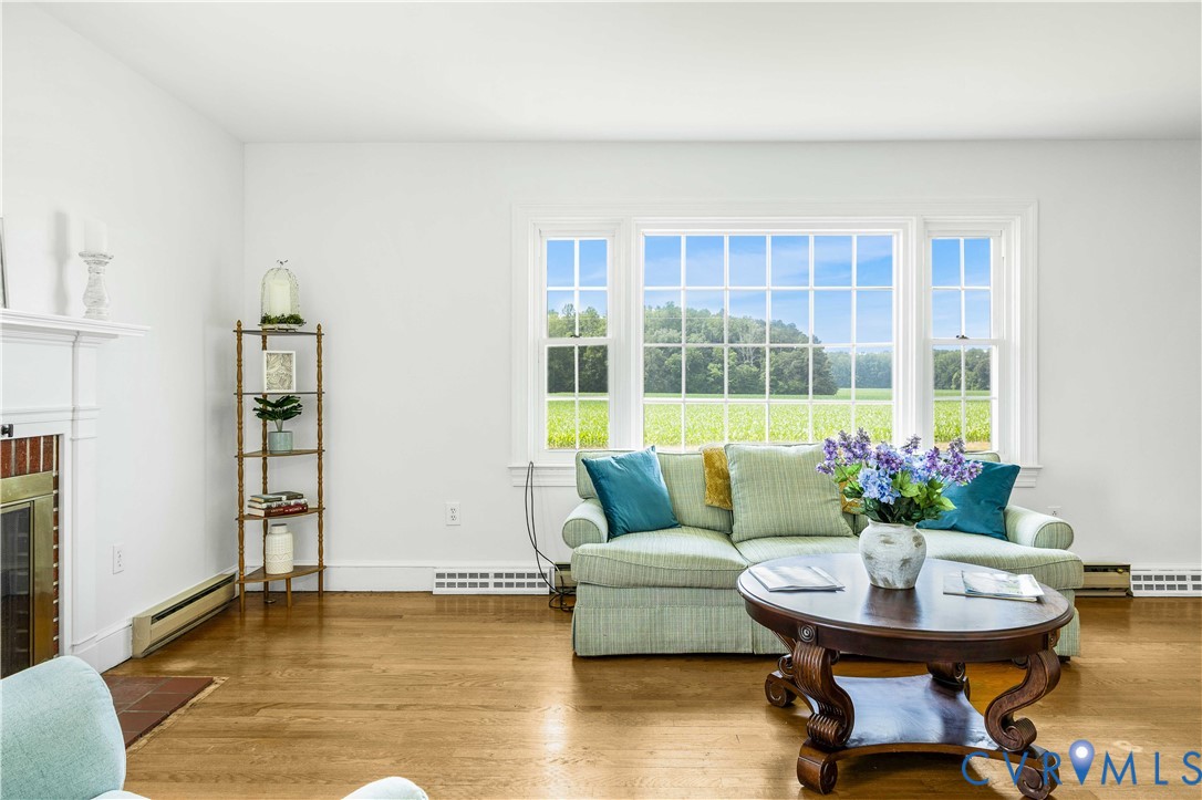 192 Morattico Road Lancaster, VA 22503 - Photo 4 of 34 a living room with furniture and a potted plant