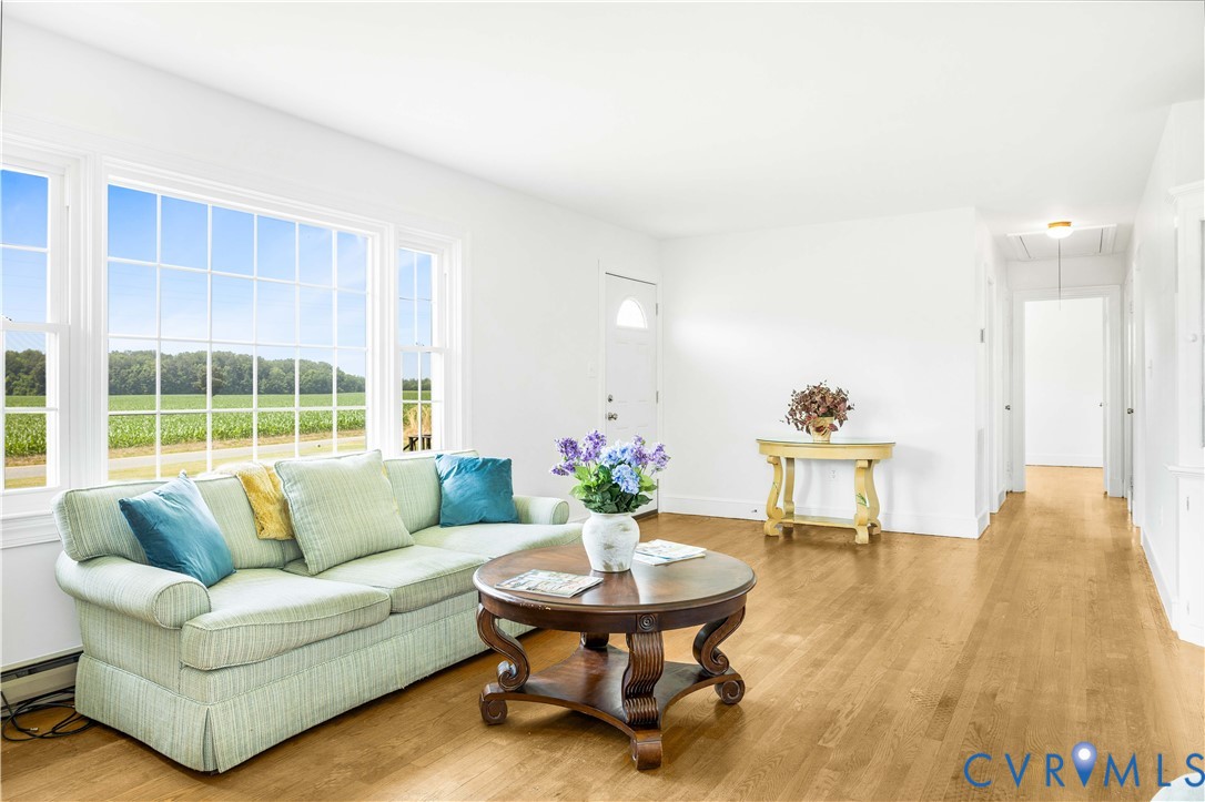 192 Morattico Road Lancaster, VA 22503 - Photo 6 of 34 a living room with furniture and a large window