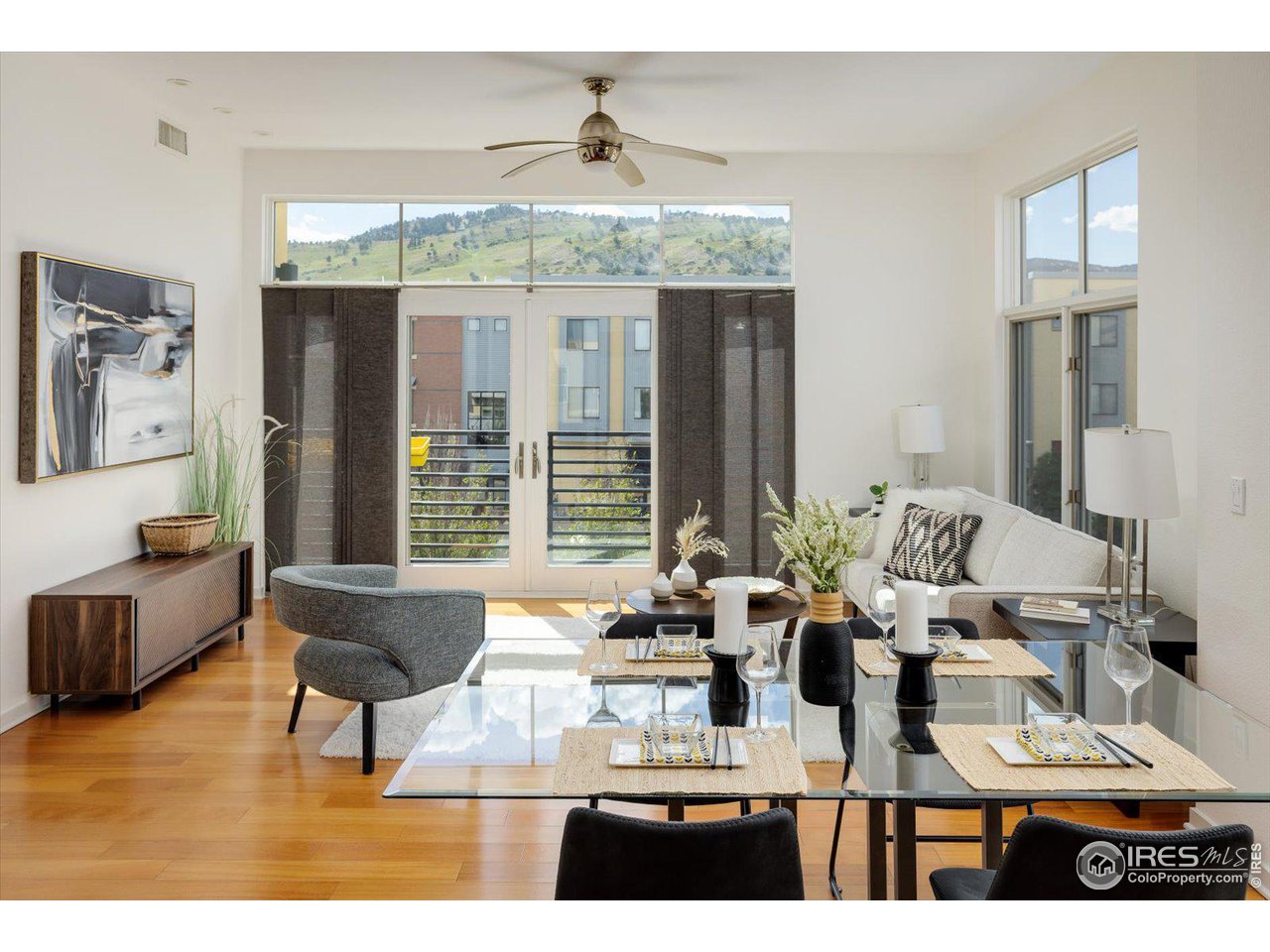 4585 13th Street, Unit D Boulder, CO 80304 - Photo 17 of 30 a living room with furniture and large windows