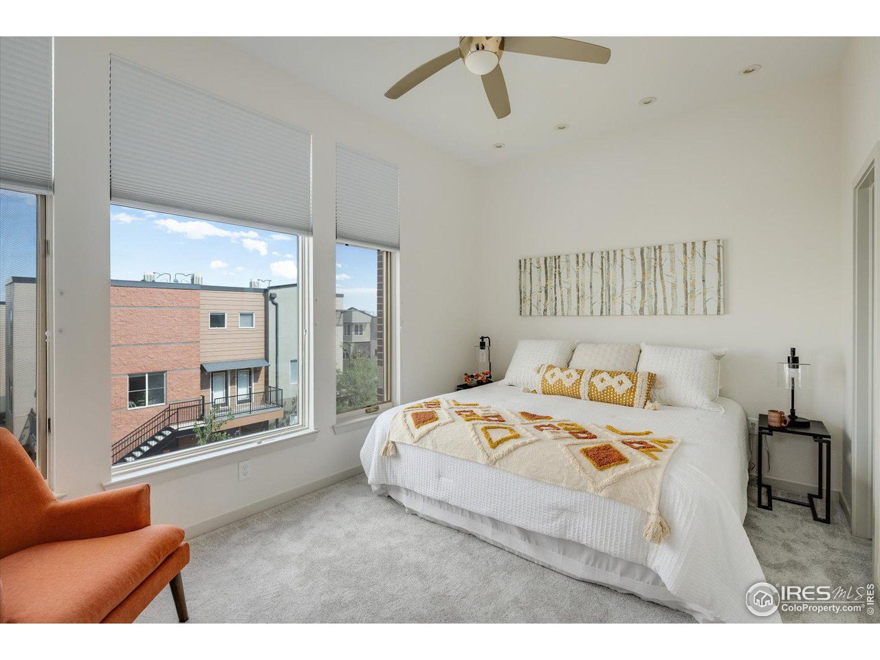 4585 13th Street, Unit D Boulder, CO 80304 - Photo 18 of 30 a bedroom with furniture and a large window