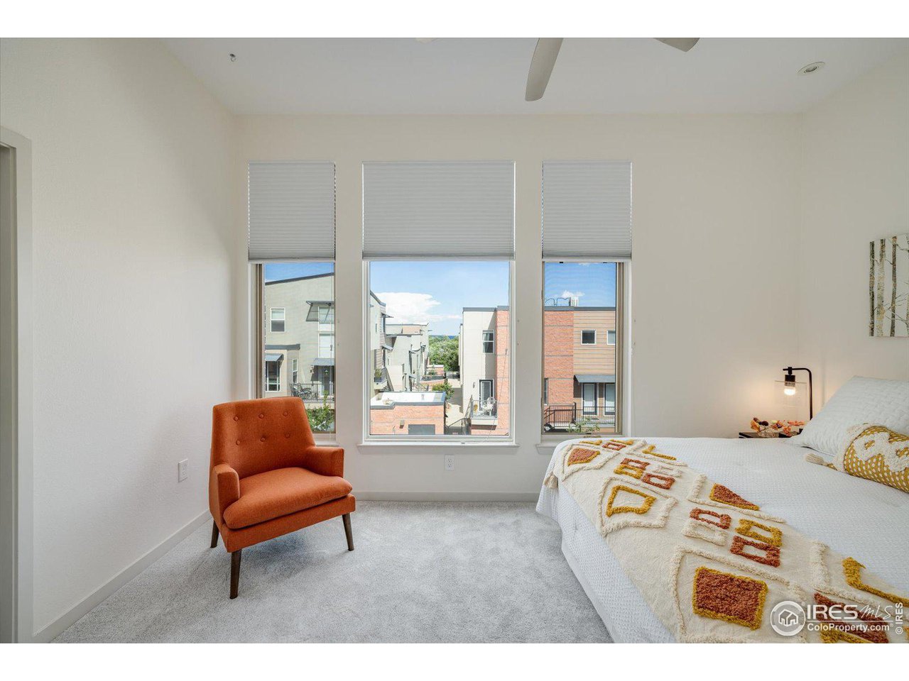 4585 13th Street, Unit D Boulder, CO 80304 - Photo 19 of 30 a bedroom with furniture and a large window