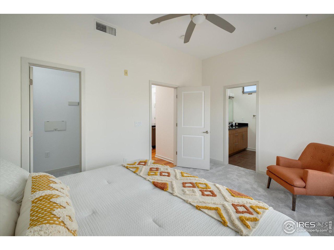 4585 13th Street, Unit D Boulder, CO 80304 - Photo 20 of 30 a bedroom with a bed and a couch