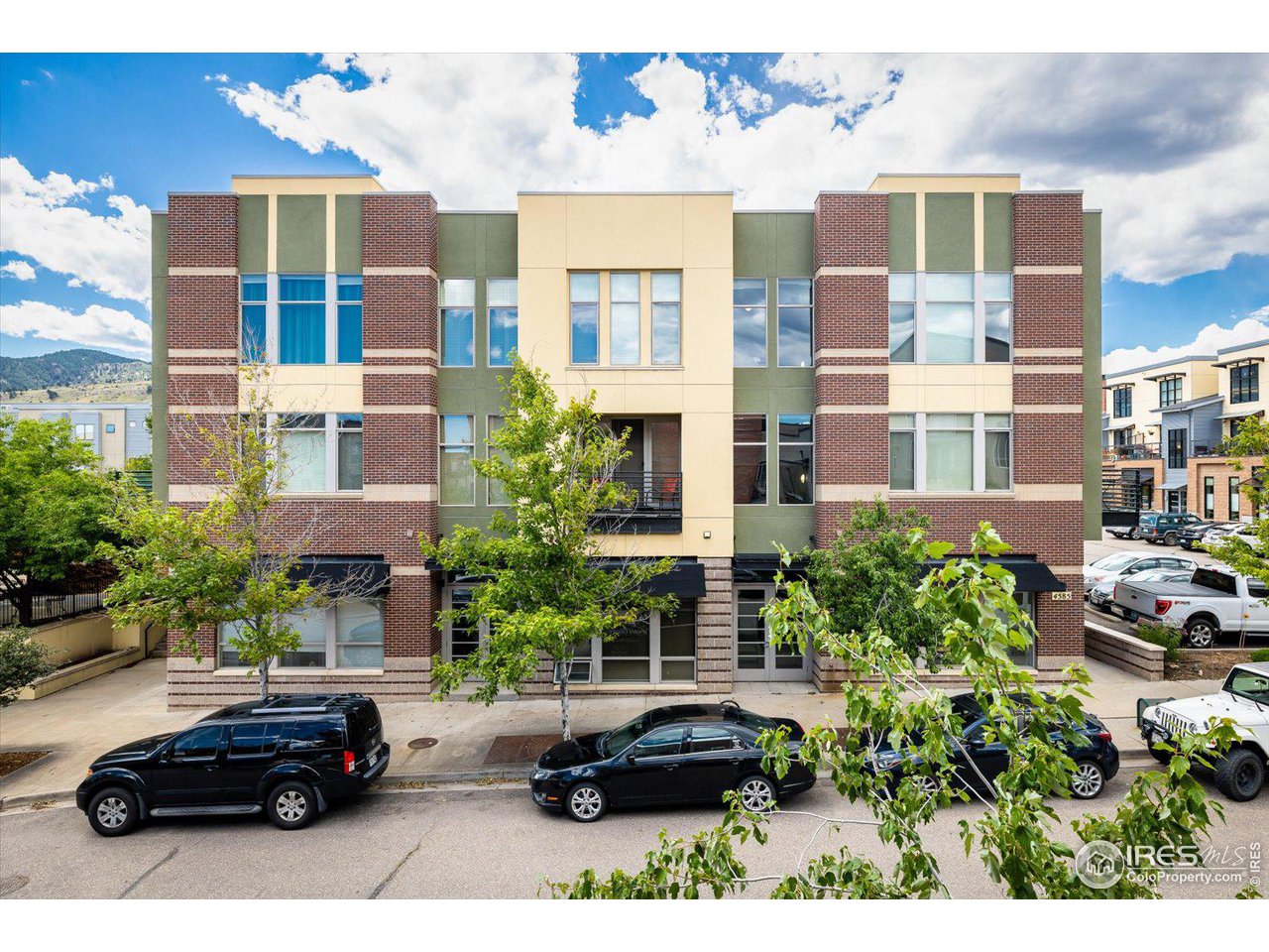 4585 13th Street, Unit D Boulder, CO 80304 - Photo 2 of 30 a couple of cars parked in front of a building