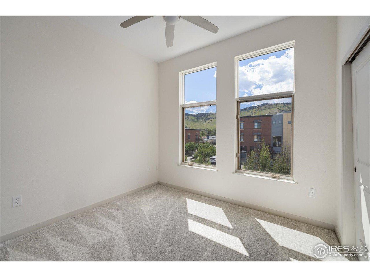 4585 13th Street, Unit D Boulder, CO 80304 - Photo 22 of 30 a view of an empty room with a window