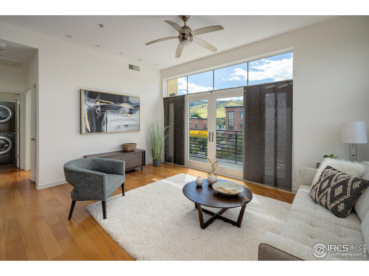 4585 13th Street, Unit D Boulder, CO 80304 - Photo 6 of 30 a living room with furniture and a large window