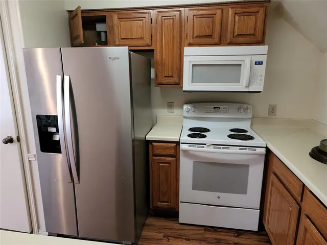 a close view of sink and cabinets