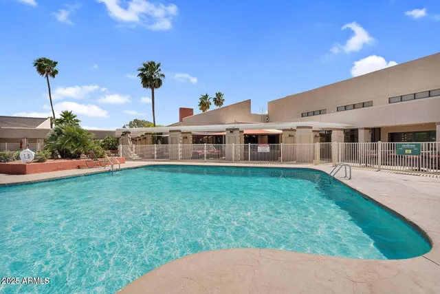 a view of a house with a backyard porch and sitting area