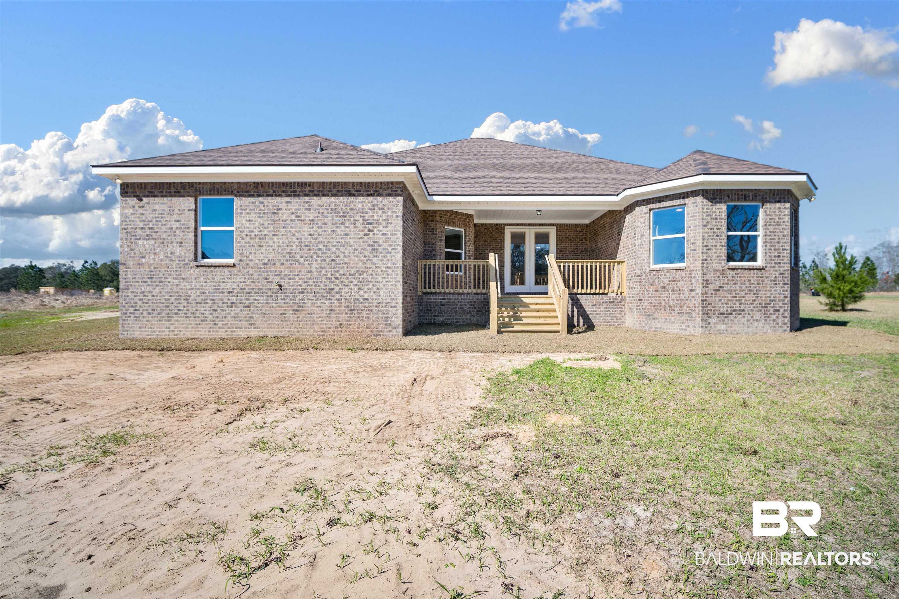 188 Hampton Ridge Mobile, AL 36608 - Photo 35 of 37 Rear view of property featuring french doors and a 1 acre cleared lot.