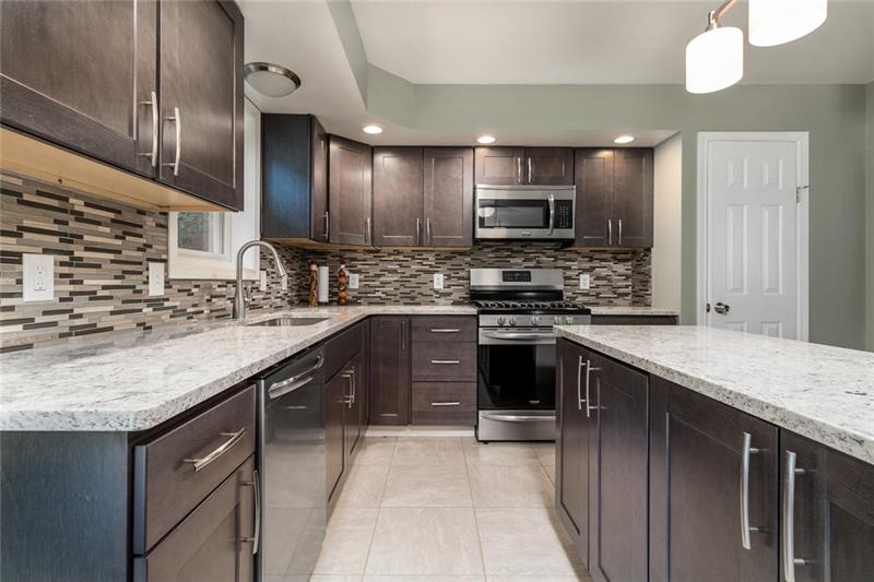 2500 Oakhill Road Gibsonia, PA 15044 - Photo 11 of 25 Kitchen with island, granite counters, new stainless appliances