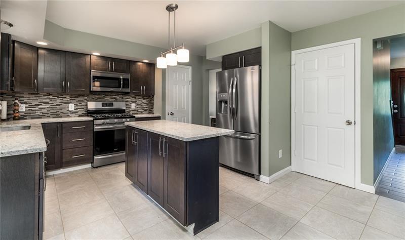 2500 Oakhill Road Gibsonia, PA 15044 - Photo 9 of 25 Kitchen with island, granite counters, new stainless appliances