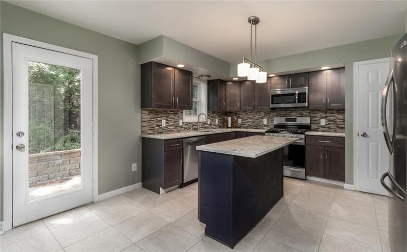 2500 Oakhill Road Gibsonia, PA 15044 - Photo 10 of 25 Kitchen with island, granite counters, new stainless appliances