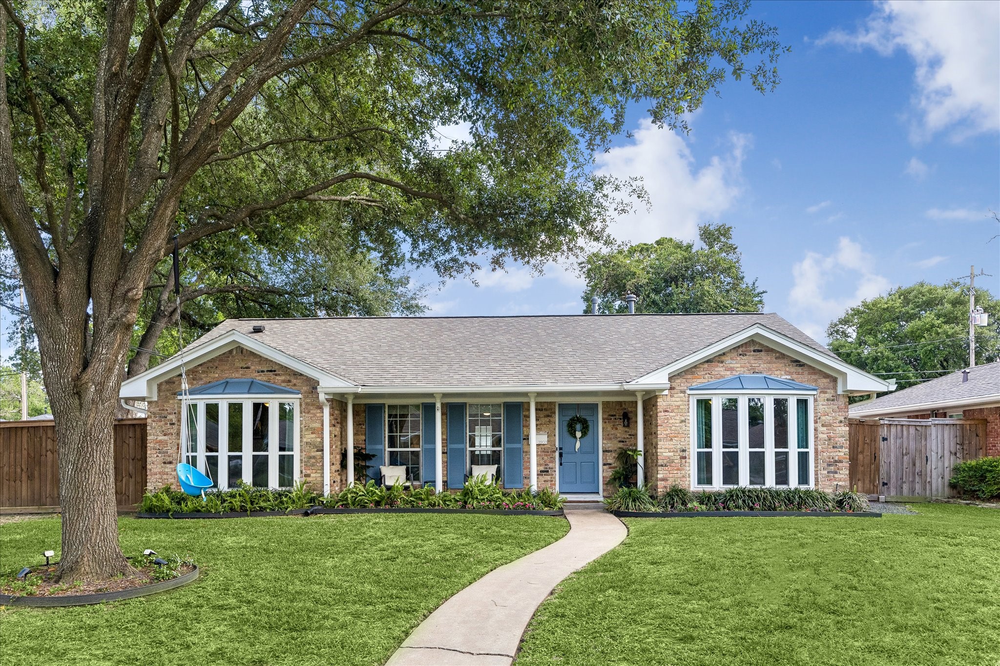 2203 Lamonte Lane Houston, TX 77018 - Photo 1 of 25 a front view of a house with a garden and porch