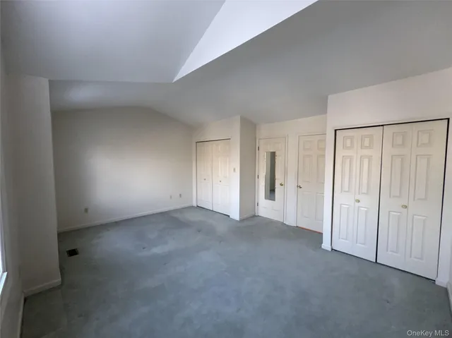a view of a bathroom with a glass door and shower