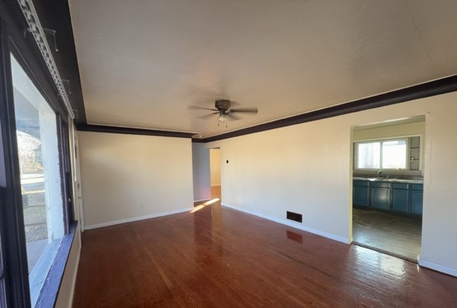 2111 Alexander Street Granite City, IL 62040 - Photo 3 of 12 an empty room with wooden floor and windows