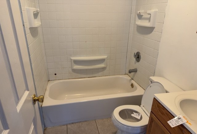 2111 Alexander Street Granite City, IL 62040 - Photo 8 of 12 a bathroom with a sink a toilet and bathtub