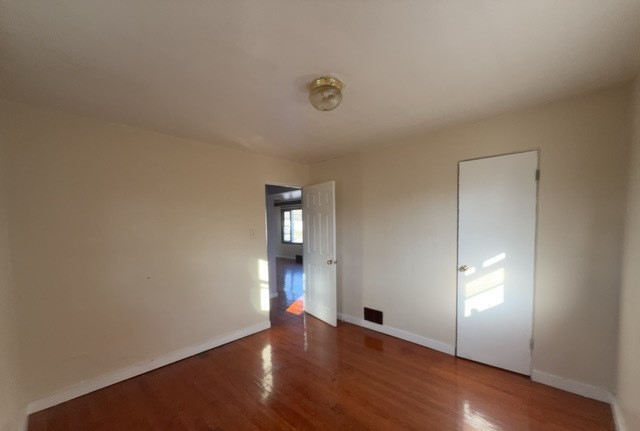 2111 Alexander Street Granite City, IL 62040 - Photo 10 of 12 a view of empty room with wooden floor and fan