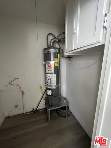 a view of a storage and utility room with empty racks