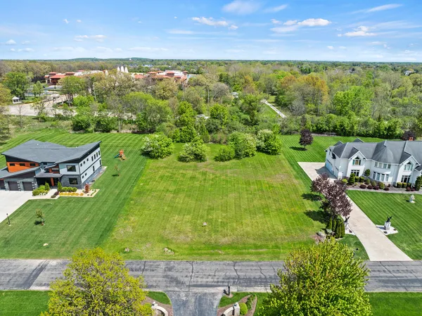a view of a lake with a yard