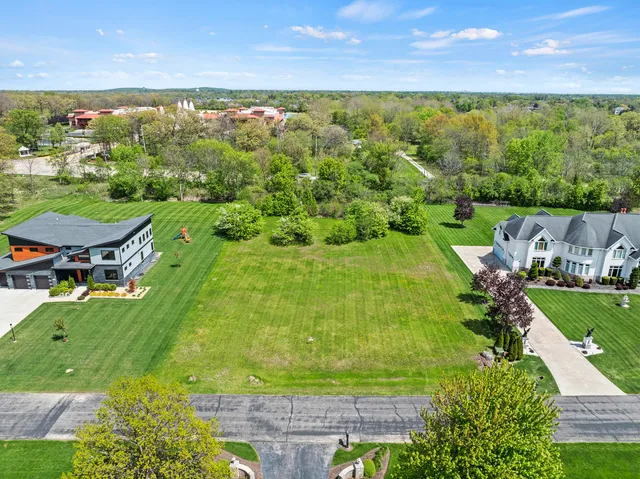a view of a lake with a yard