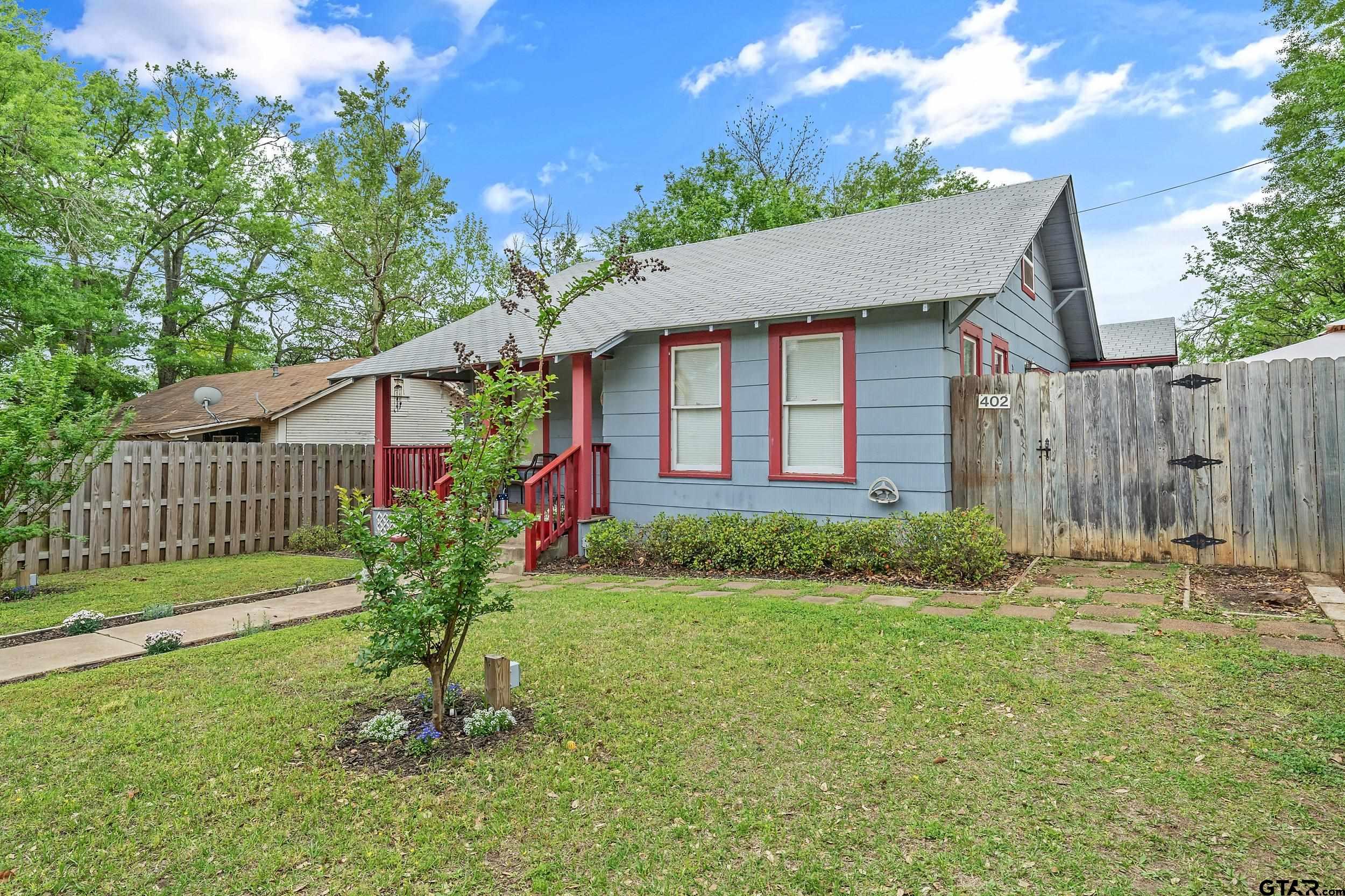 402 Bonner Street Rusk, TX 75785 - Photo 3 of 25 a brick house with garden in front of it