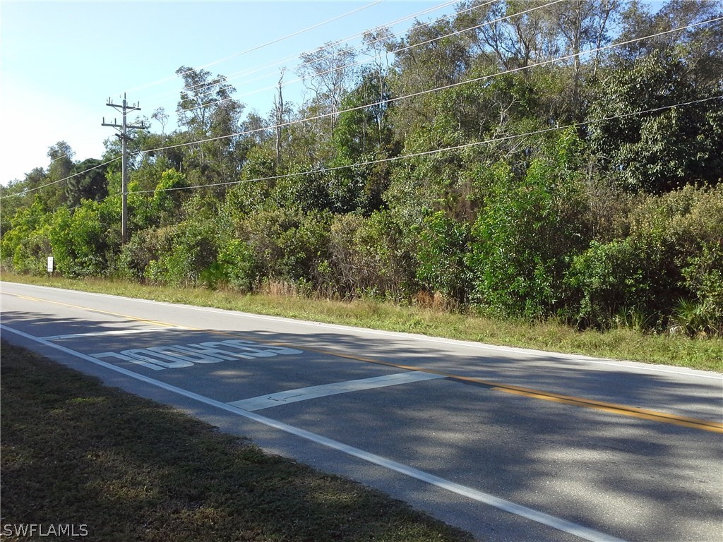 10659 Stringfellow Road Bokeelia, FL 33922 - Photo 5 of 5 a view of a yard