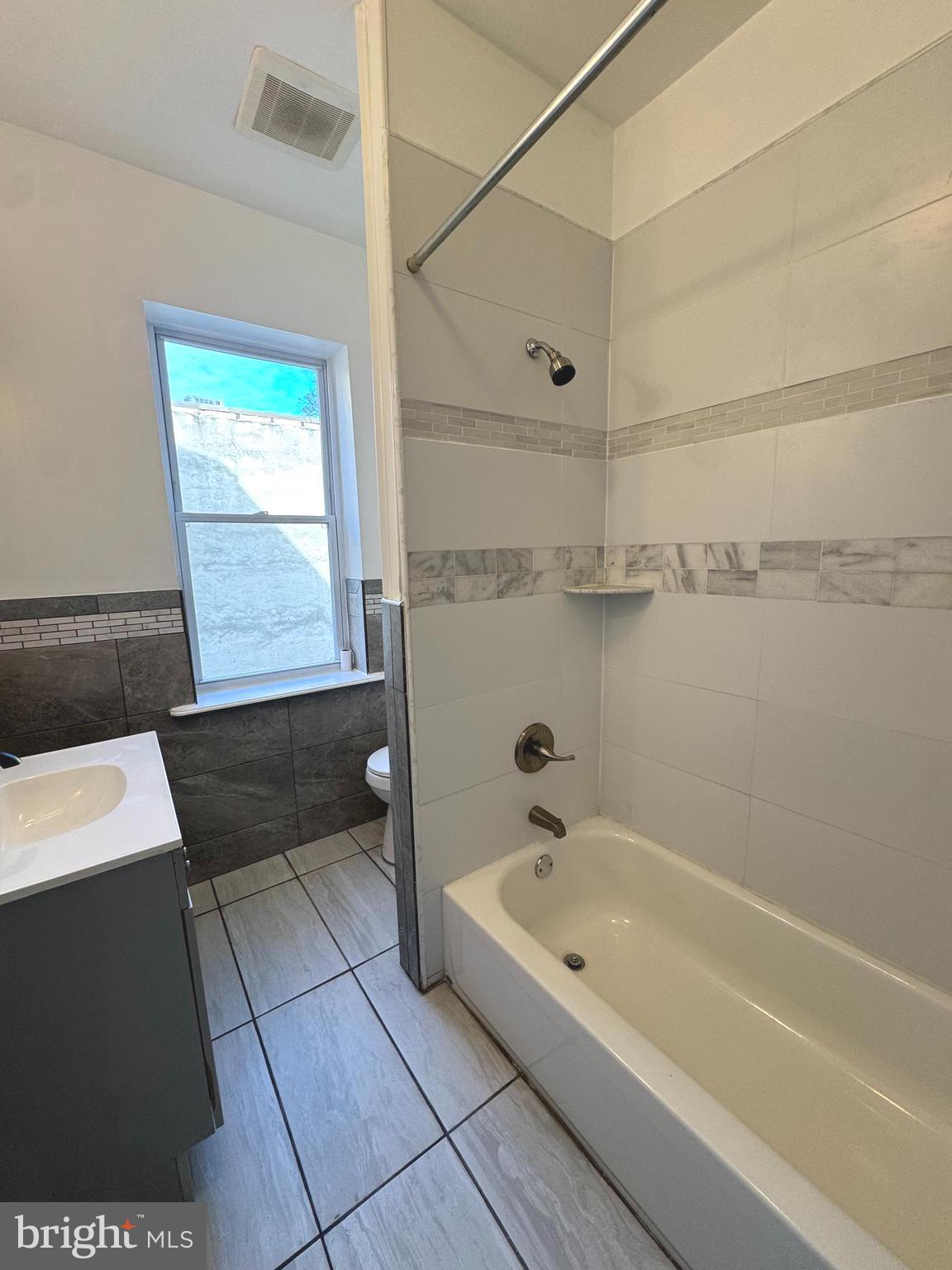 2121 North 20th Street, Unit 2 Philadelphia, PA 19121 - Photo 3 of 9 a bathroom with a bathtub and a shower