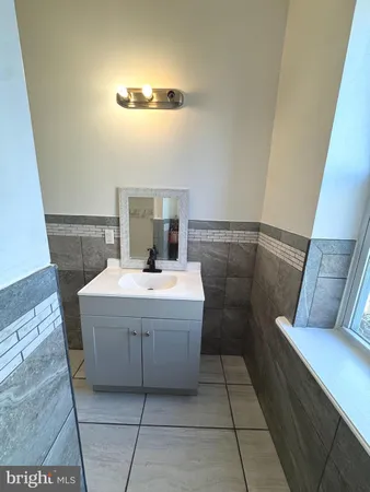 a bathroom with a sink and mirror