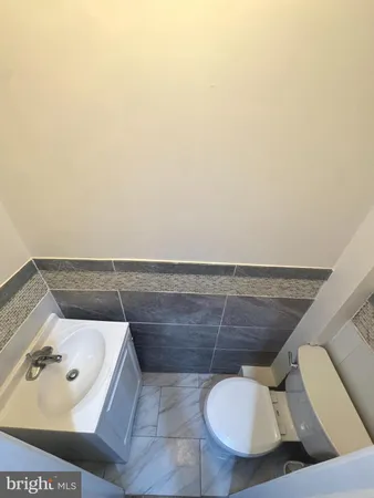 a bathroom with a toilet and a sink