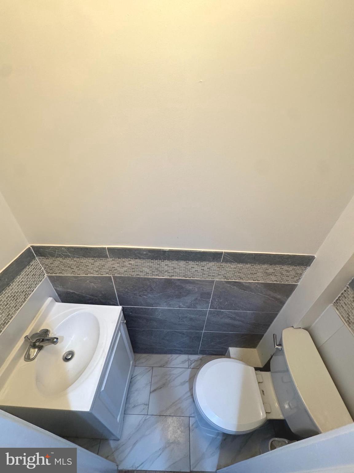 2121 North 20th Street, Unit 2 Philadelphia, PA 19121 - Photo 8 of 9 a bathroom with a toilet and a sink