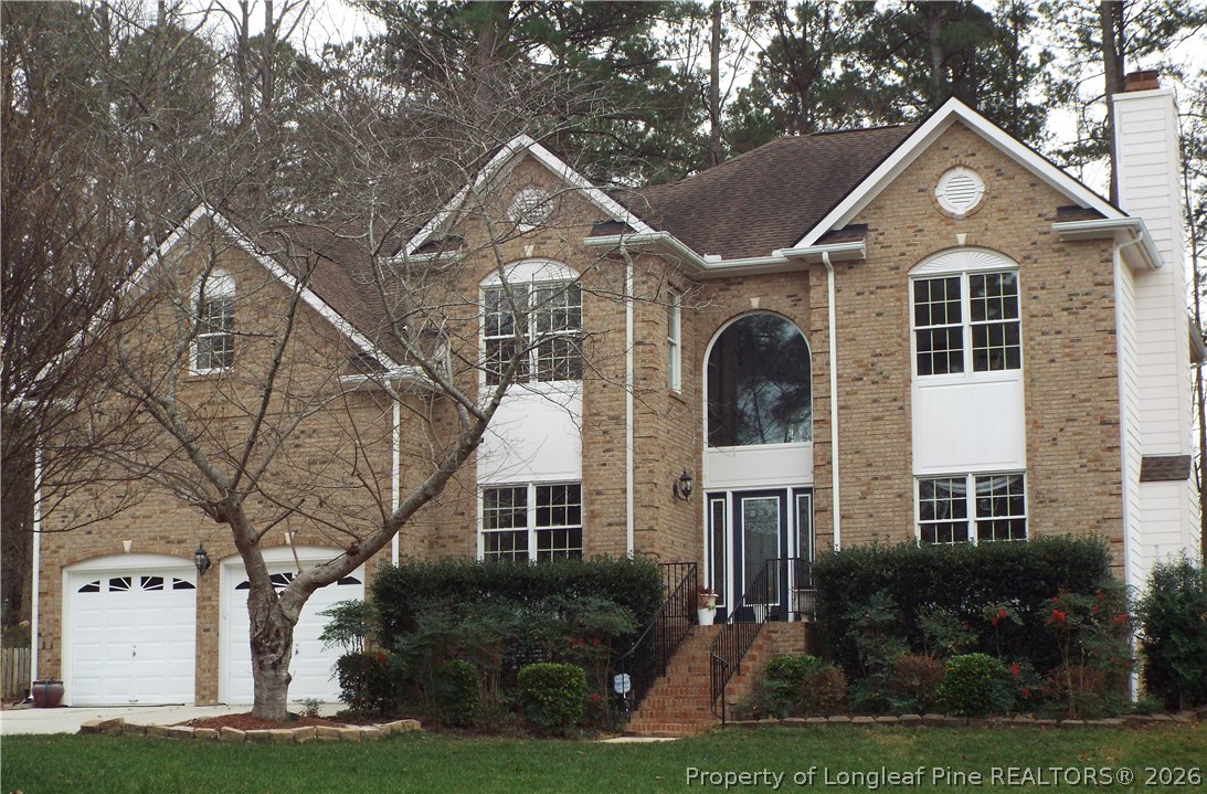 203 Ticonderoga Road Cary, NC 27519 - Photo 2 of 18 a front view of a house with a yard
