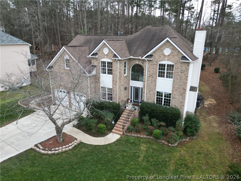 203 Ticonderoga Road Cary, NC 27519 - Photo 4 of 18 a front view of a house with a yard