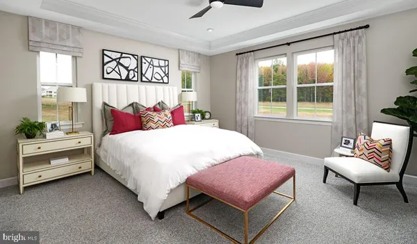 a bedroom with a bed and a couch