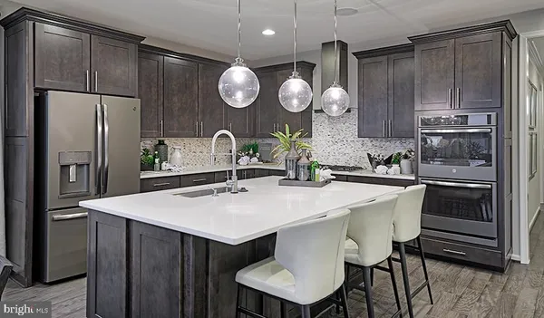 a kitchen with a table and refrigerator
