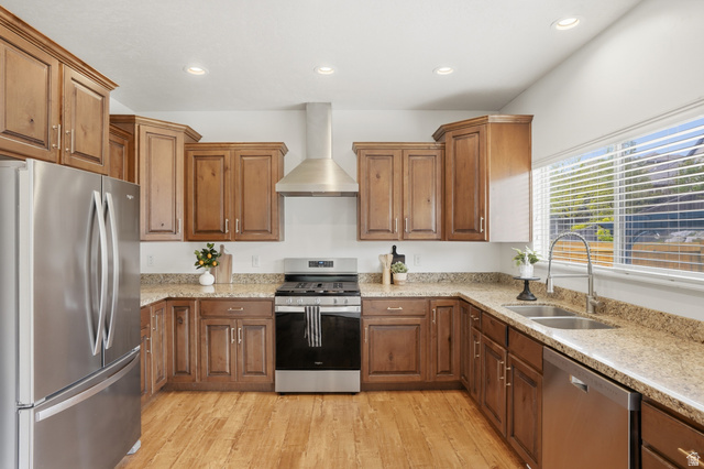 2007 Fielding Hill Lane Draper, UT 84020 - Photo 17 of 83 Kitchen featuring wood-finish flooring, stainless steel appliances, granite-style countertops, wood cabinetry, and recessed lighting