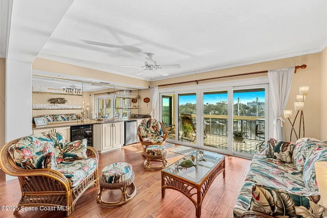 a view of a balcony dining table and chairs