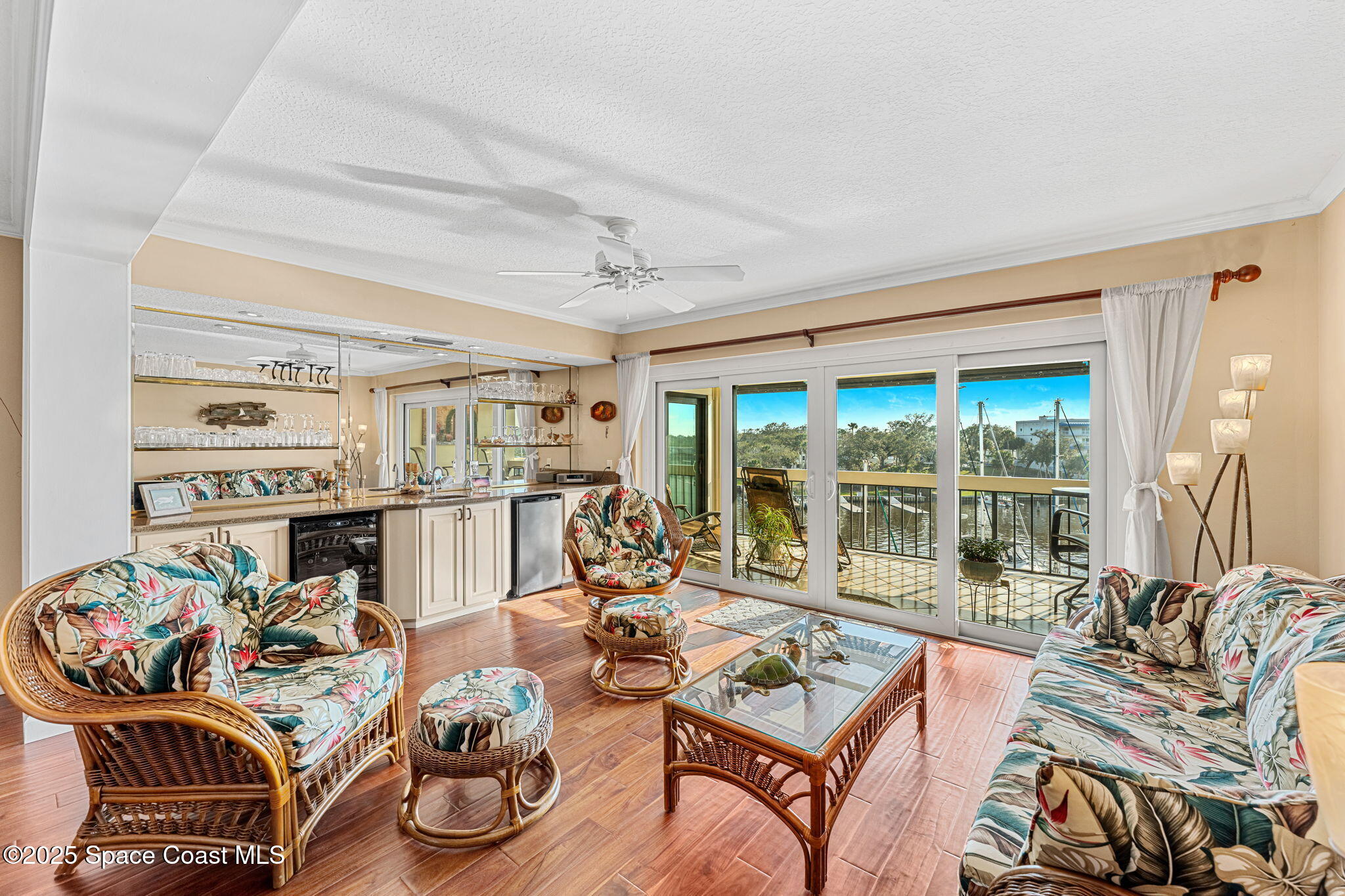 2220 Front Street, Unit 404 Melbourne, FL 32901 - Photo 17 of 52 a living room with furniture and a floor to ceiling window