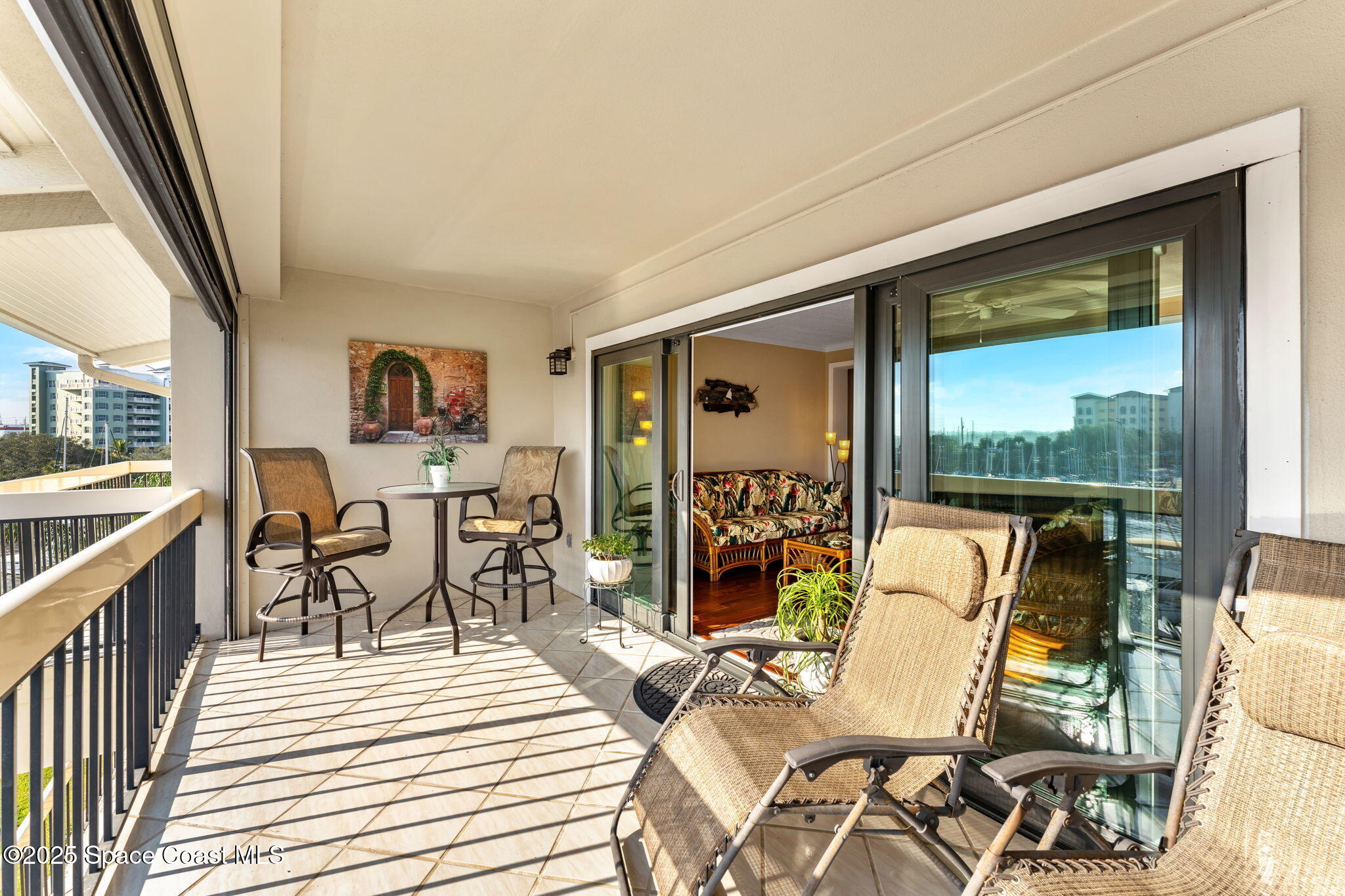2220 Front Street, Unit 404 Melbourne, FL 32901 - Photo 20 of 52 a dining room with furniture a rug and wooden floor