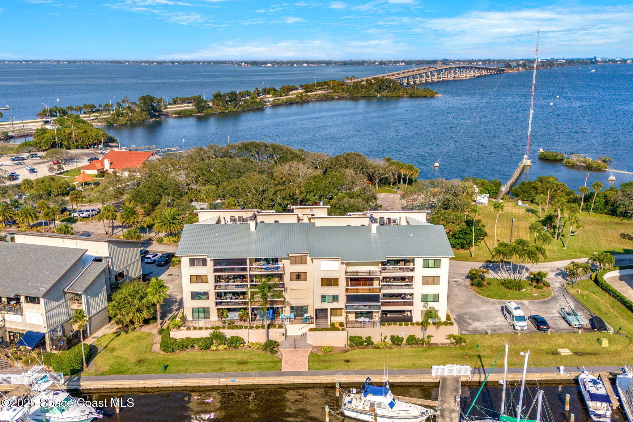 2220 Front Street, Unit 404 Melbourne, FL 32901 - Photo 22 of 52 an aerial view of residential building and lake view