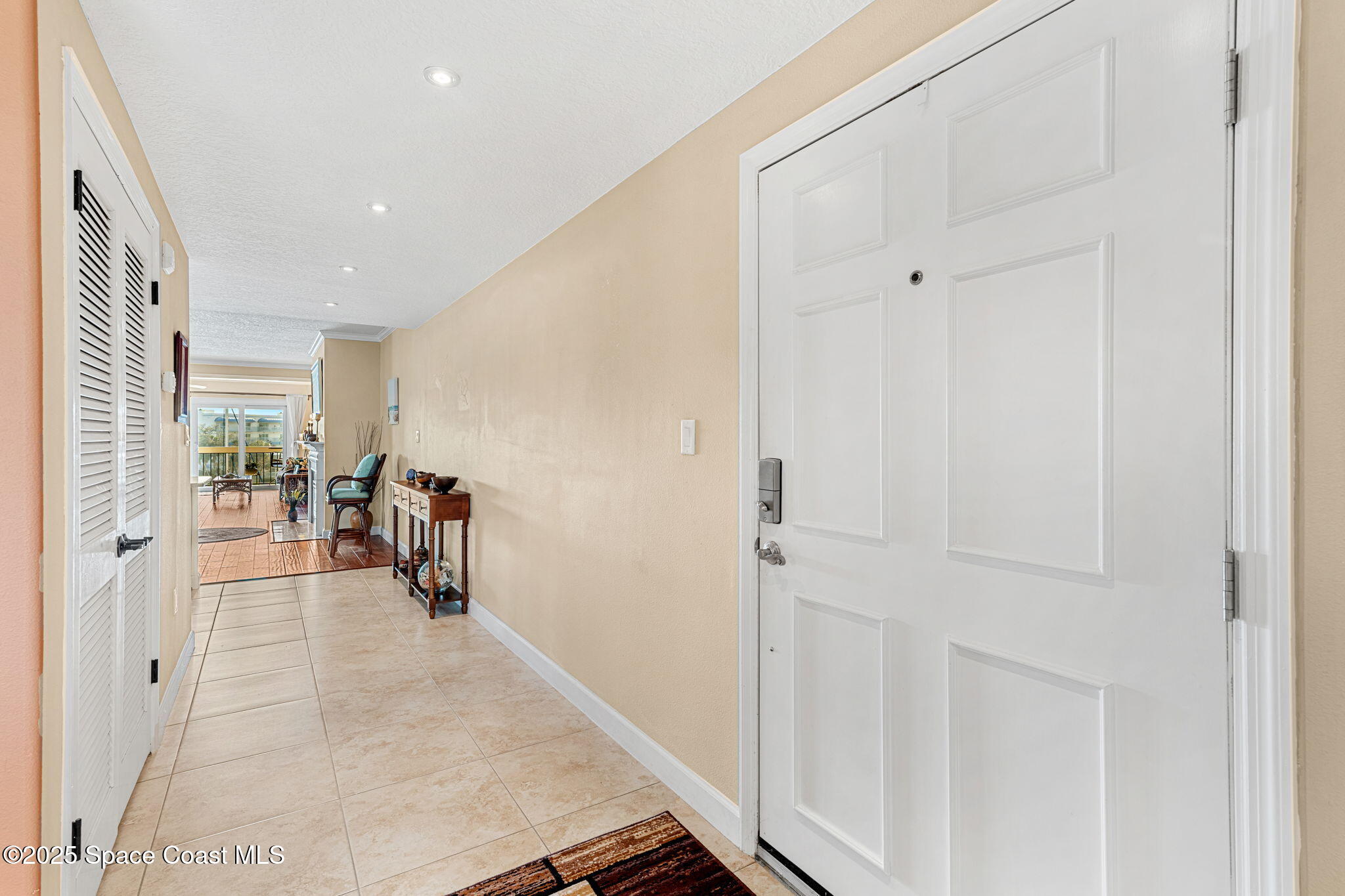 2220 Front Street, Unit 404 Melbourne, FL 32901 - Photo 37 of 52 a view of a hallway with furniture and a livingroom view
