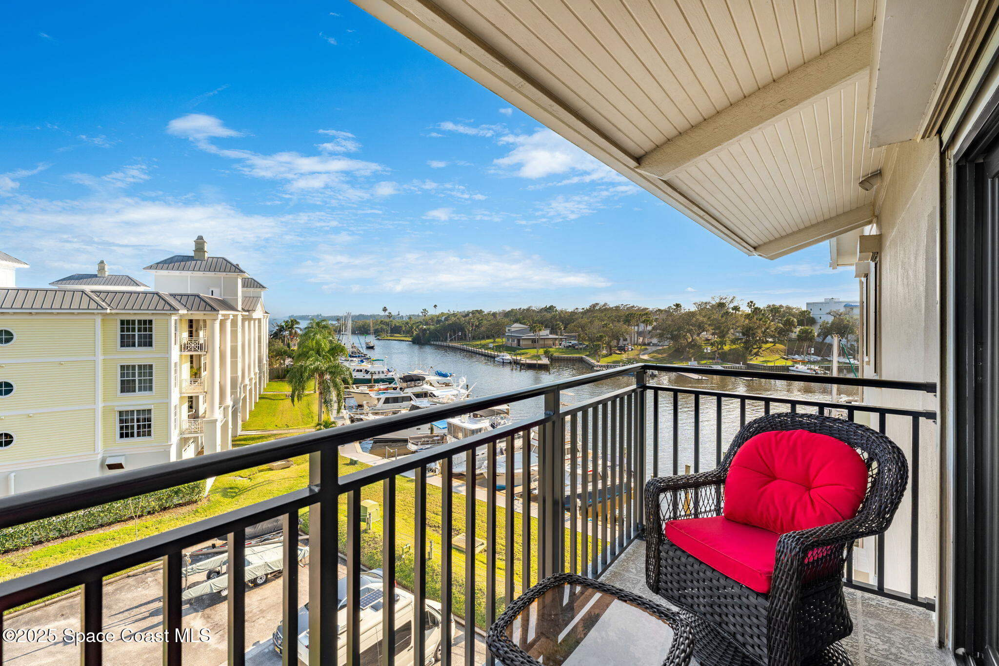2220 Front Street, Unit 404 Melbourne, FL 32901 - Photo 41 of 52 a view of a city from a balcony with furniture