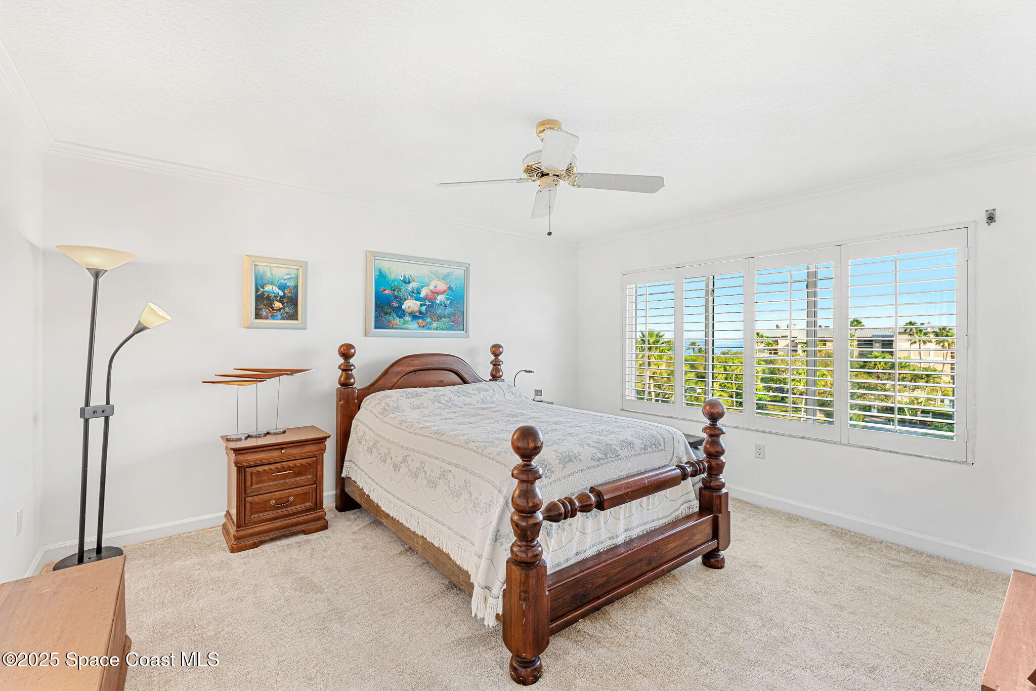 2220 Front Street, Unit 404 Melbourne, FL 32901 - Photo 44 of 52 a bed sitting in a spacious bedroom next to a window