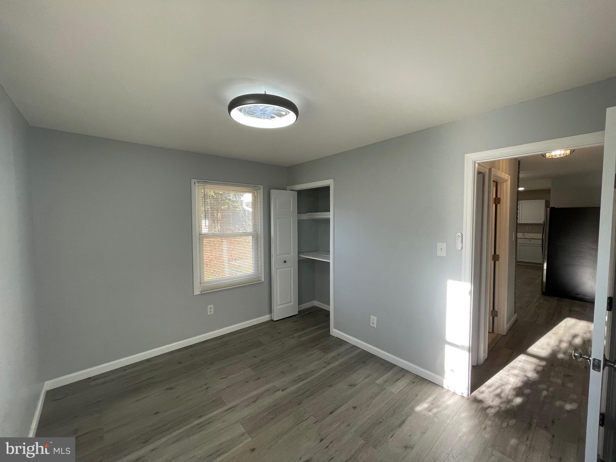 229 Garner Avenue Waldorf, MD 20602 - Photo 13 of 25 an empty room with wooden floor and windows